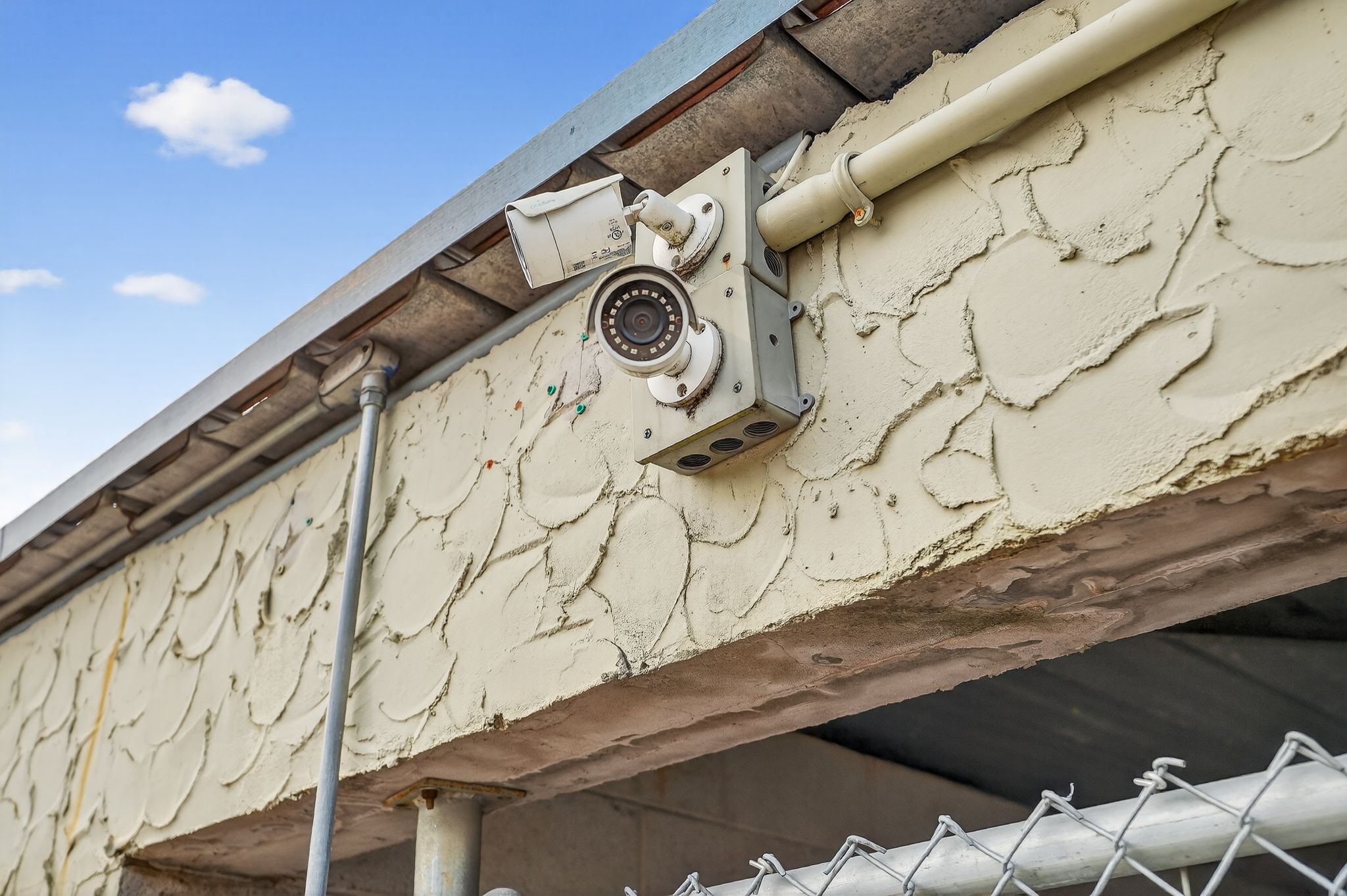 03-mounted security cameras watching the main drive at the tillery facility.jpg